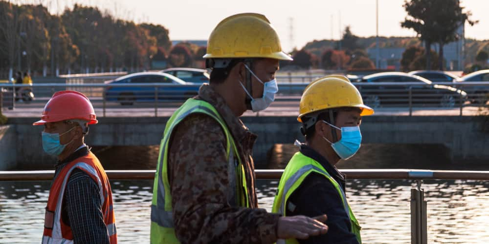 Construction workers walking to jobsite